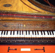 antique harpsichord with tuning forks